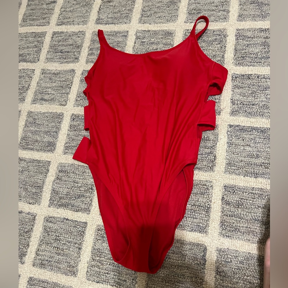 Red swim suit, lemon swim top, black crocheted cover up